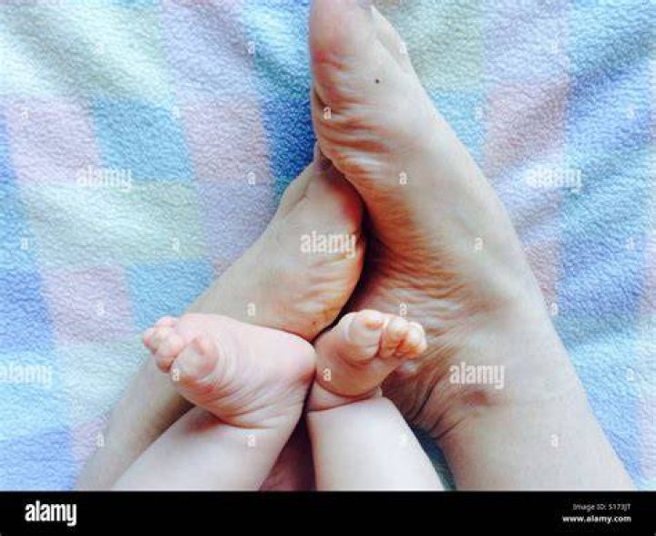 Baby and Mom feet Stock Photo Alamy