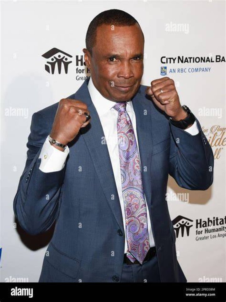Boxing Legend Sugar Ray Leonard Enjoys a Family Bike Ride with His Wife