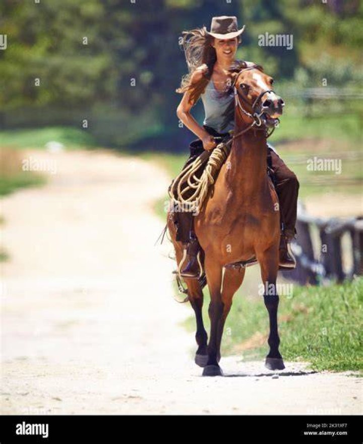 Cowgirl Riding a Horse at a Rodeo