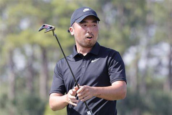 Doug Ghim's caddie Jeff Ghim on No. 2 during the second round of the