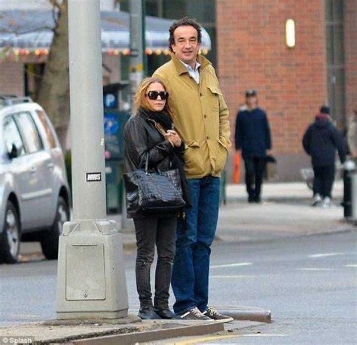 MaryKate Olsen, 26, dwarfed by boyfriend Olivier Sarkozy, 42, as they take stroll before