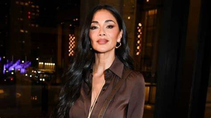 Nicole Scherzinger turns up the heat in a latex bralet and matching tartan pencil skirt Daily