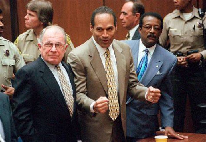 O.J. Simpson after his acquittal, with his son Jason on the left and