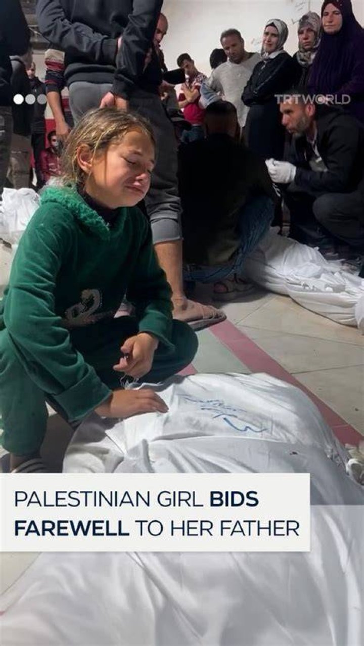 Palestinian Father Bids Farewell to His Daughter, Embracing Her in a