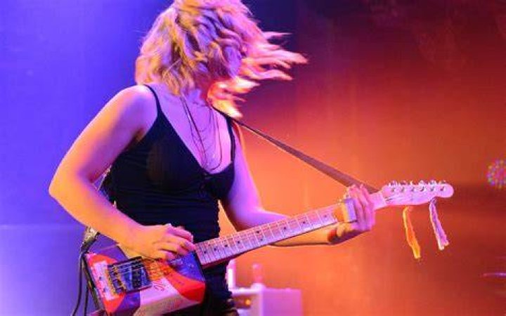 Rocktober Samantha with an electric guitar by ShinyJonDiamondGlitz on